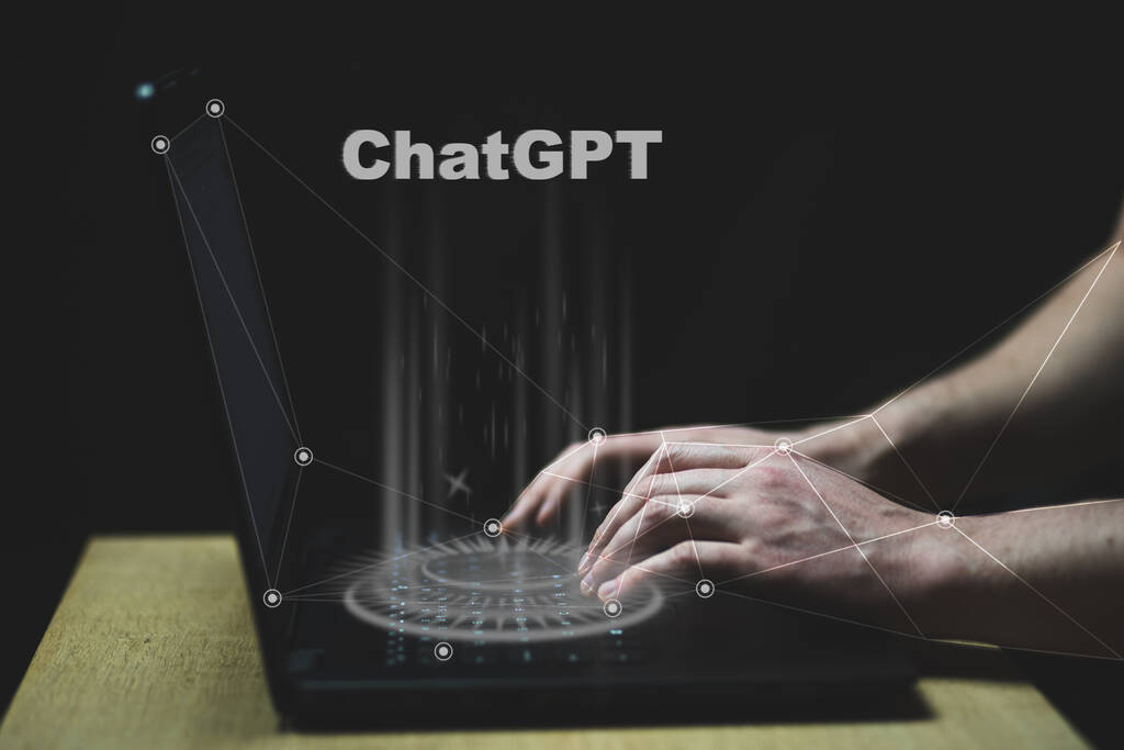 ChatGPT hologram on PC keyboard typing. ChatGPT is a chatbot launched by OpenAI. High quality photo